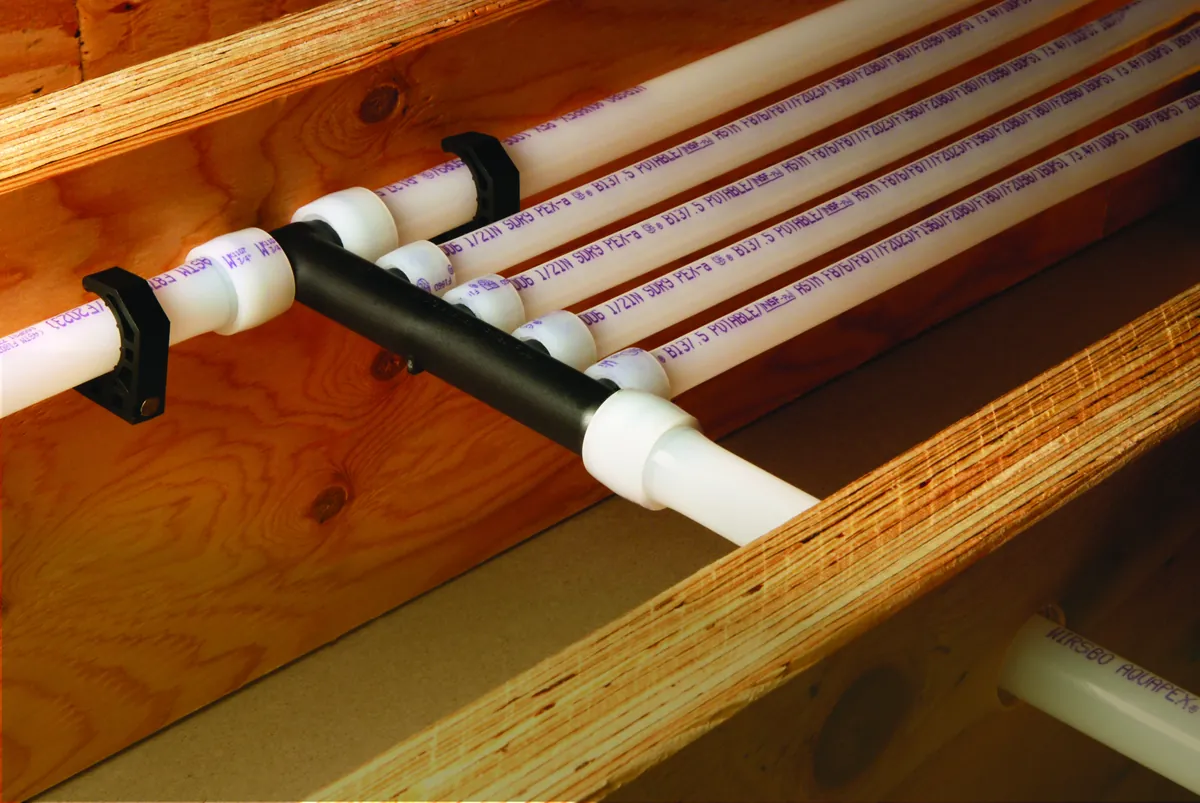PEX multiport tee mounted across floor joists – Navien Tankless Water Heater Installation for Rancho Santa Margarita Homes for Rancho Santa Margarita, CA homes